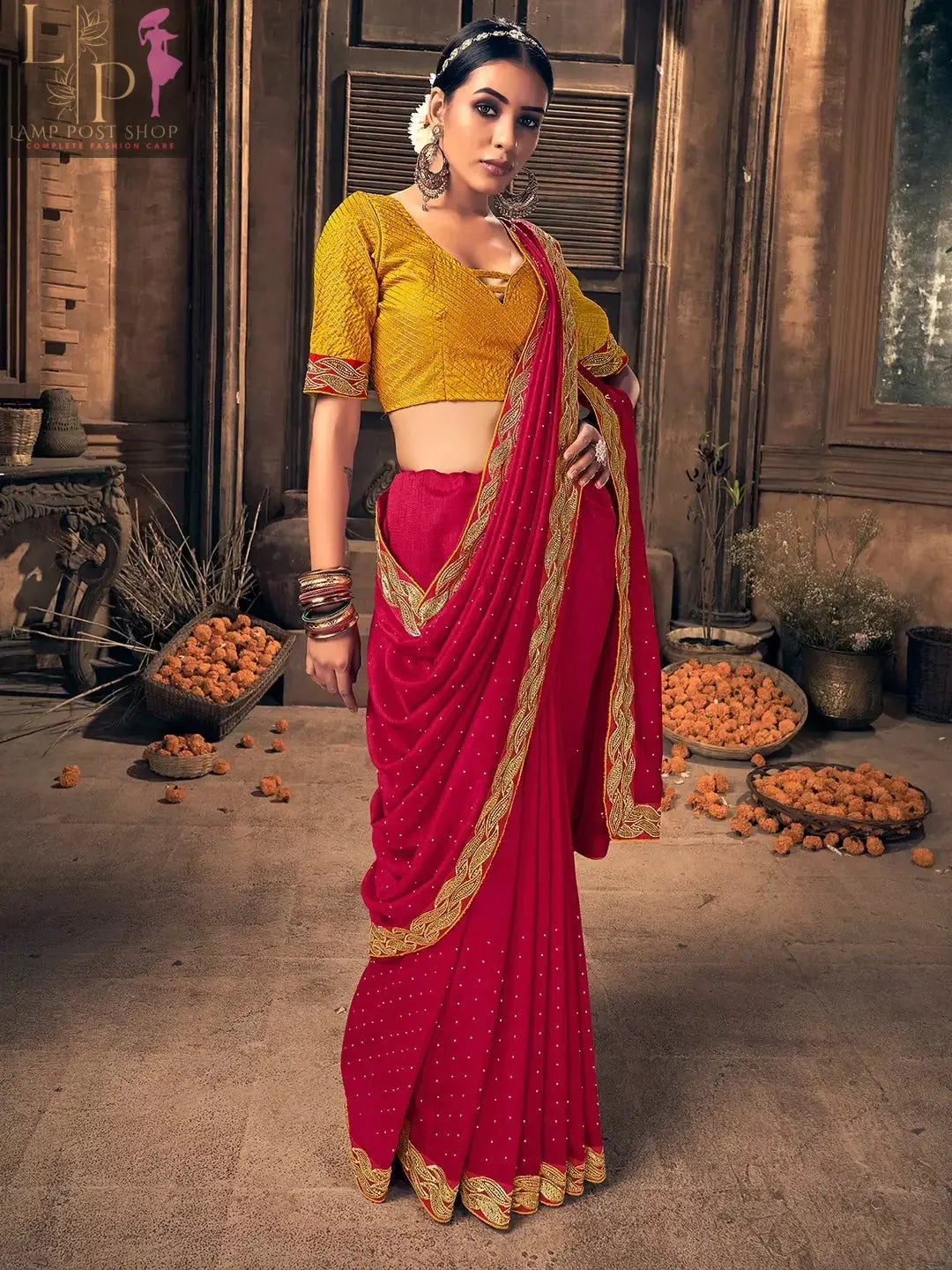 a woman wears red color sarees with yellow color blouse