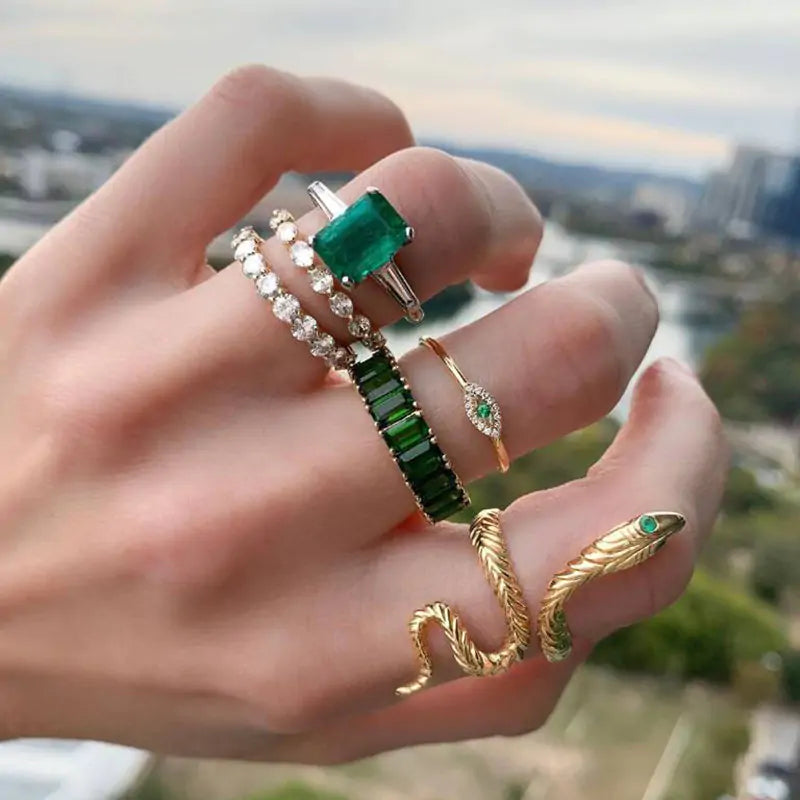 Gold vintage ring set by Lamp Post featuring intricate designs and multiple rings displayed together.