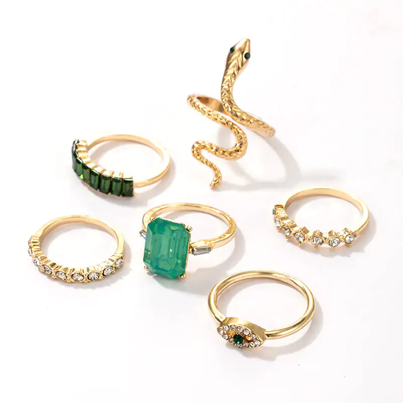 Gold vintage ring set by Lamp Post featuring multiple stylish rings with intricate designs and a classic finish.
