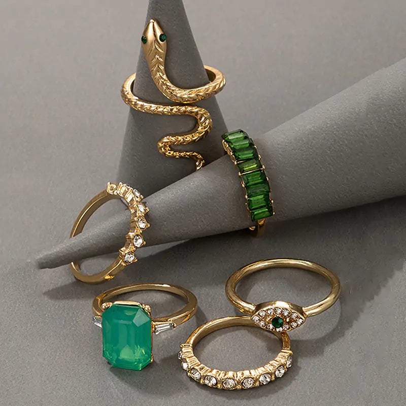 Gold vintage ring set by Lamp Post featuring multiple ornate rings with intricate designs and antique-inspired style.