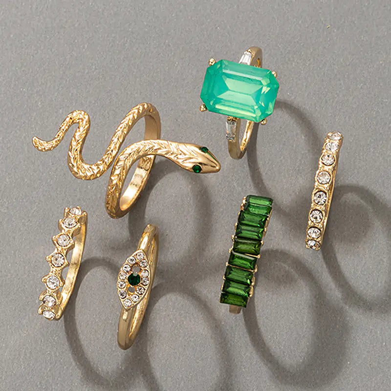 Gold vintage ring set by Lamp Post featuring multiple rings with intricate designs and antique-inspired style.