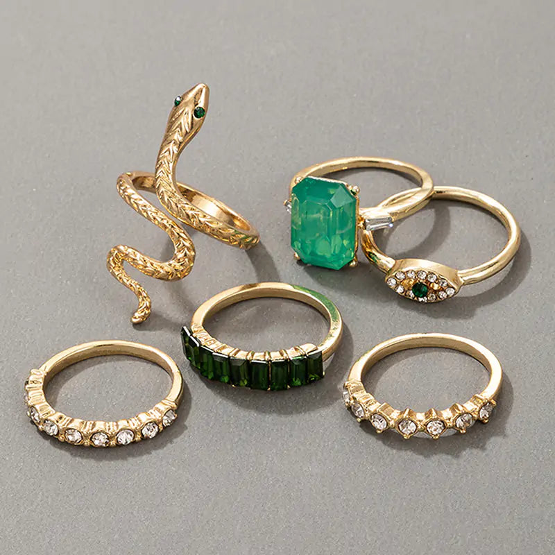Gold vintage ring set by Lamp Post featuring multiple rings with intricate designs and antique-inspired details.
