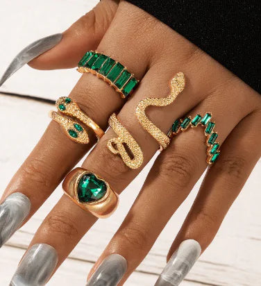 Gold vintage ring set by Lamp Post featuring multiple ornate rings with intricate designs and antique-inspired details.