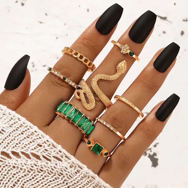 Gold vintage ring set by Lamp Post featuring multiple rings with intricate designs and antique-style detailing.