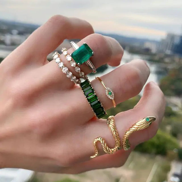 Gold vintage ring set by Lamp Post featuring multiple stacked rings with intricate designs and antique-inspired details.