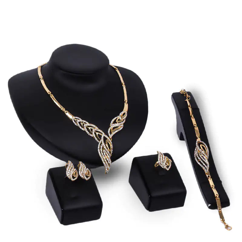 Gold Indian bridal jewelry set for women featuring intricate traditional designs, including necklace, earrings, and bangles.