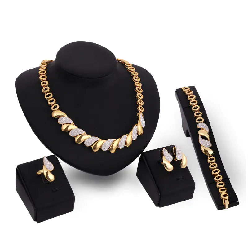 Gold Indian bridal jewelry set for women, featuring intricate necklace, earrings, and bangles, by Lamp Post.