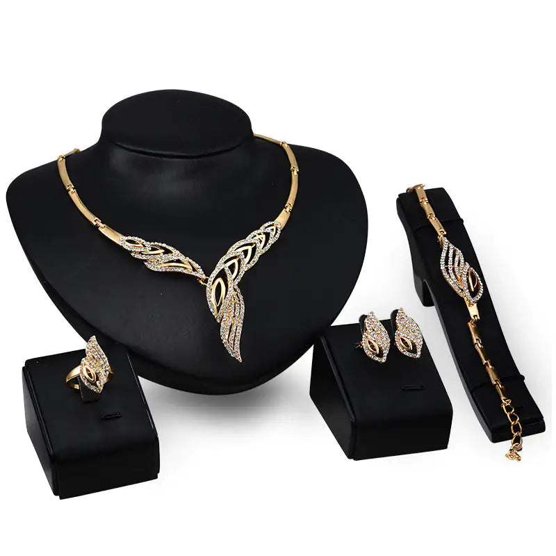 Gold Indian bridal jewelry set for women, featuring intricate traditional designs, includes necklace, earrings, and matching accessories.