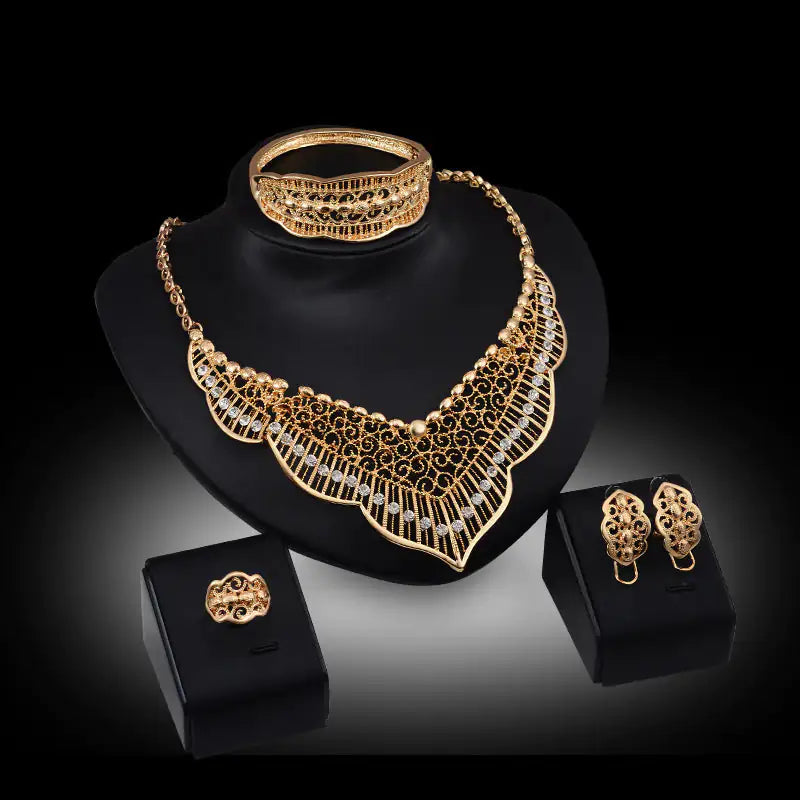 Gold Indian bridal jewelry set for women, featuring intricate traditional designs, including necklace, earrings, and bangles.