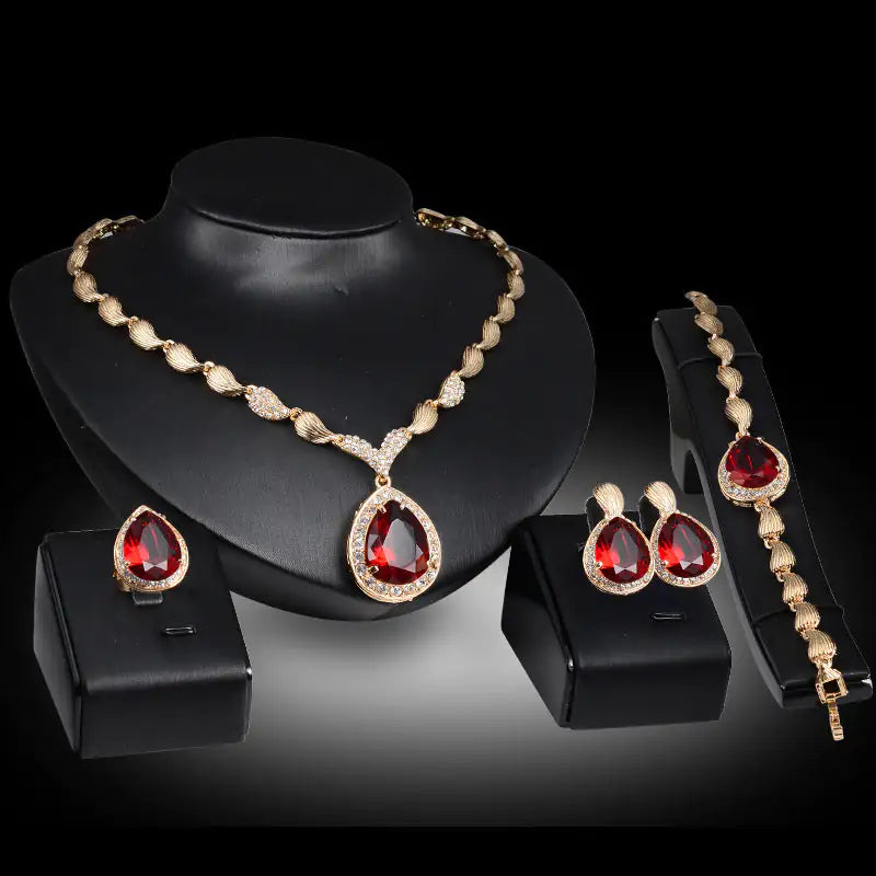Gold Indian bridal jewelry set for women featuring traditional earrings, necklace, and bangles from Lamp Post.