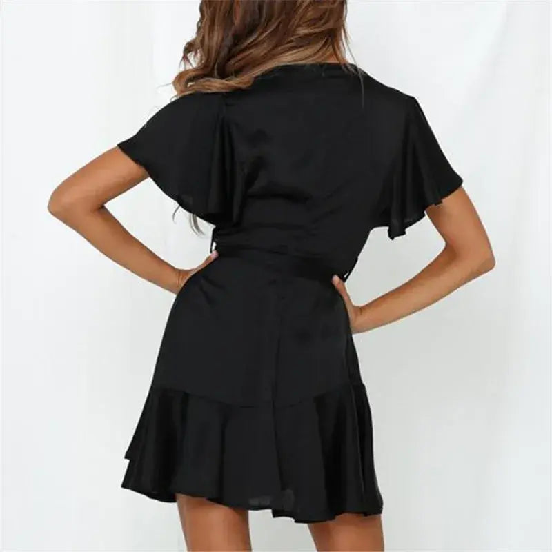 Apricot-colored Summer V-Neck Ruffle Women’s Dress by Lamp Post, featuring a flowy design and feminine ruffle details.