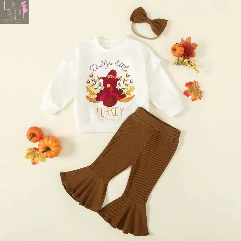 Toddler girl Thanksgiving outfit by Lamp Post featuring a turkey print long sleeve sweatshirt and matching headband for ages 6M-3Y.