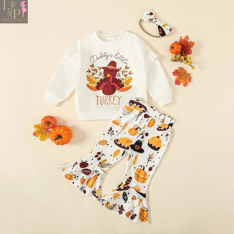 Toddler girl Thanksgiving outfit by Lamp Post featuring a turkey print long sleeve sweatshirt and matching headband for ages 6M-3Y.