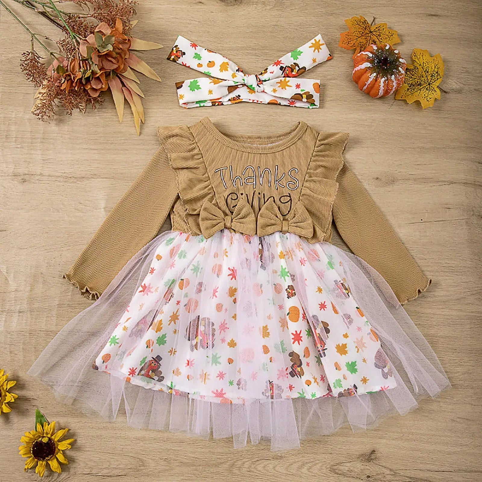Toddler girl Thanksgiving dress by Lamp Post with ruffled long sleeves, turkey print, crew neck, and matching bow headband.