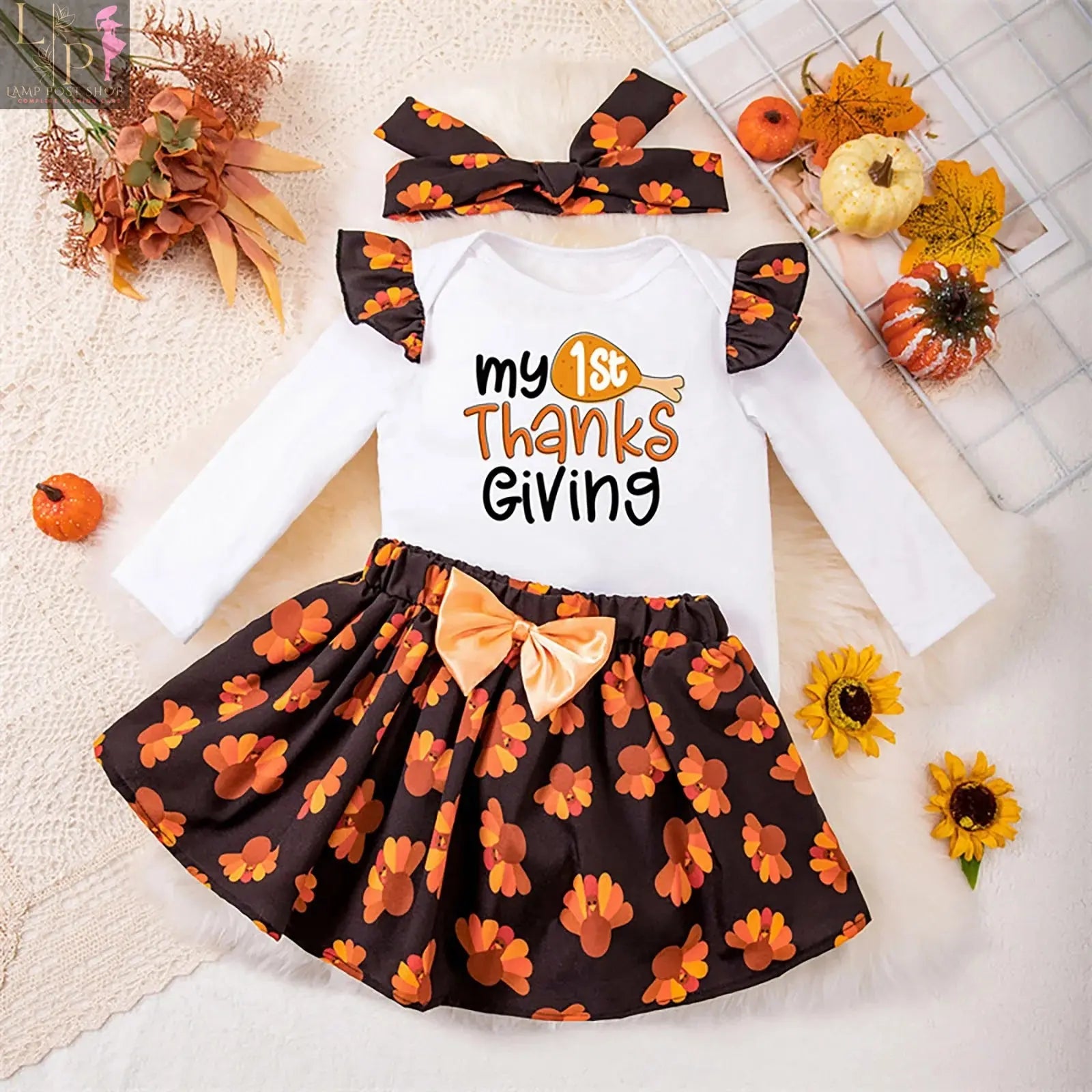 Girls' long sleeve Thanksgiving dress by Lamp Post featuring a cartoon turkey print, perfect for baby girls aged 12-18 months.