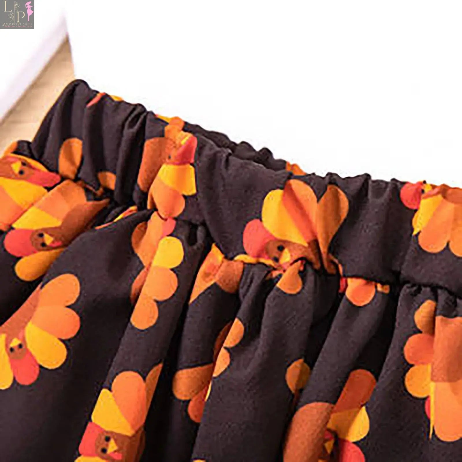 Orange long sleeve baby girl dress with cartoon turkey print, perfect for Thanksgiving, by Lamp Post for girls aged 12-18 months.