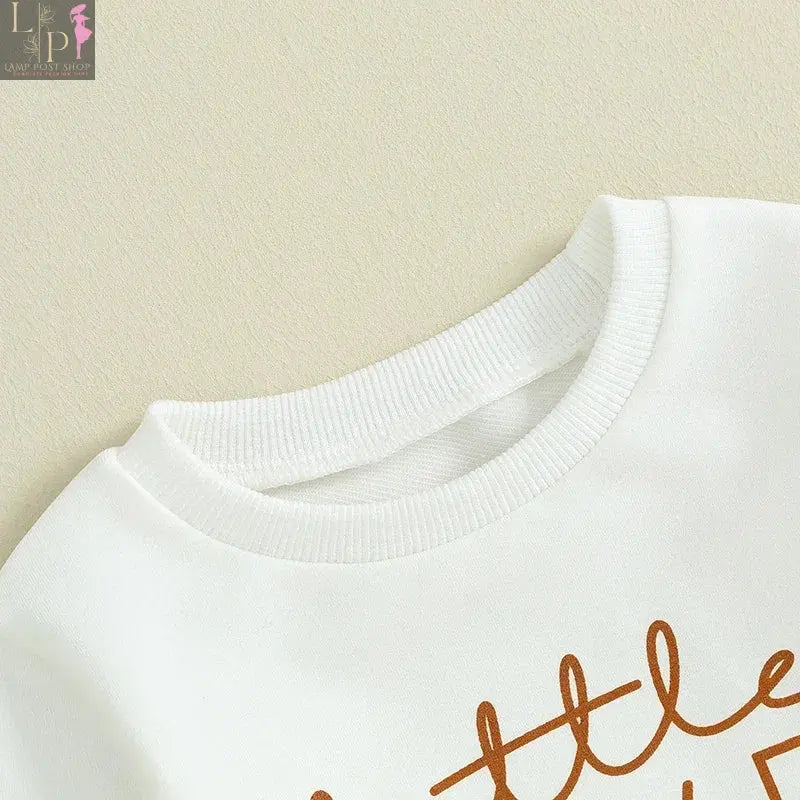 Baby boy outfit by Lamp Post featuring a white letter print long sleeve sweatshirt and solid color pants for Thanksgiving festival.