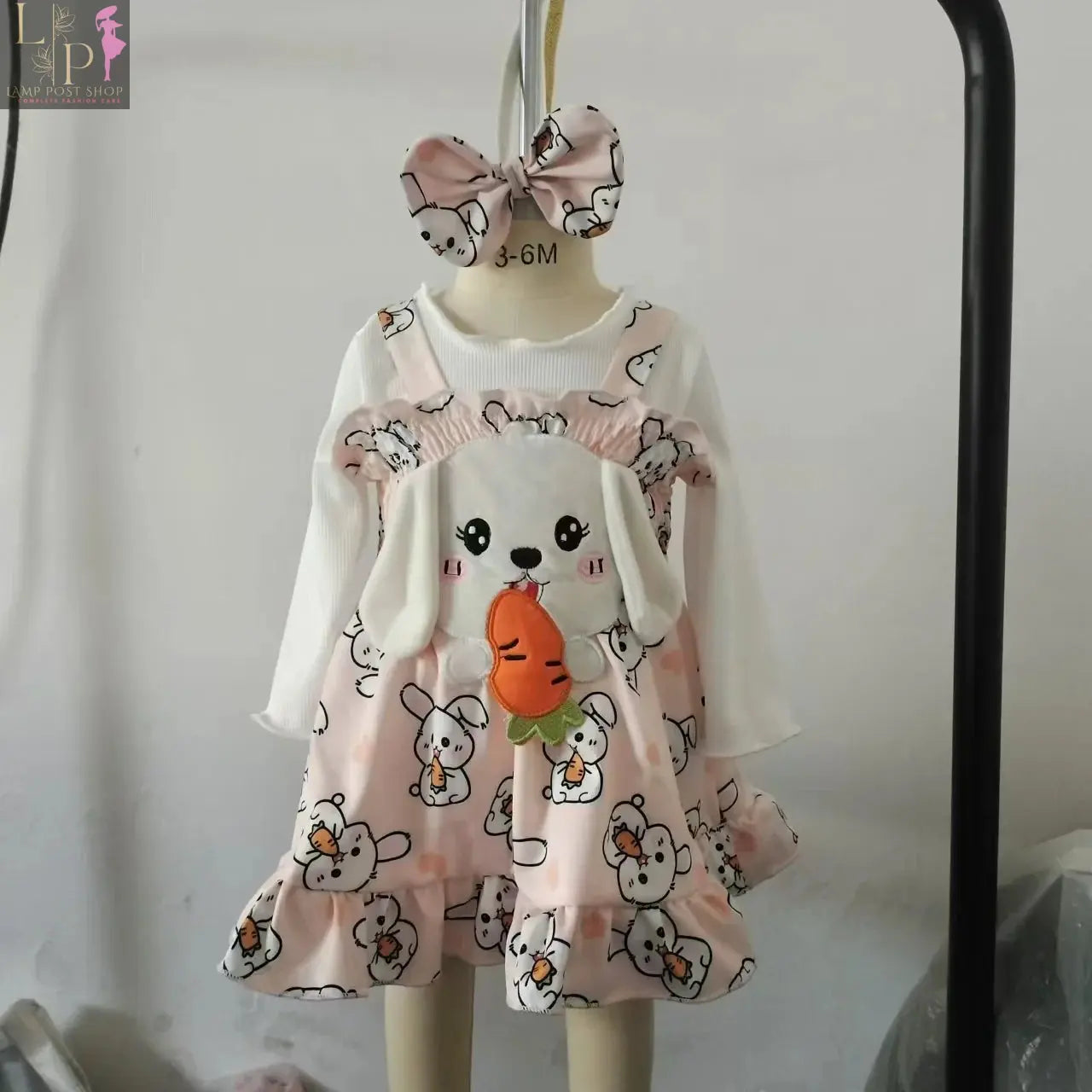 Baby girl long sleeve Thanksgiving jumpsuit by Lamp Post featuring a turkey design, perfect for fall celebrations.