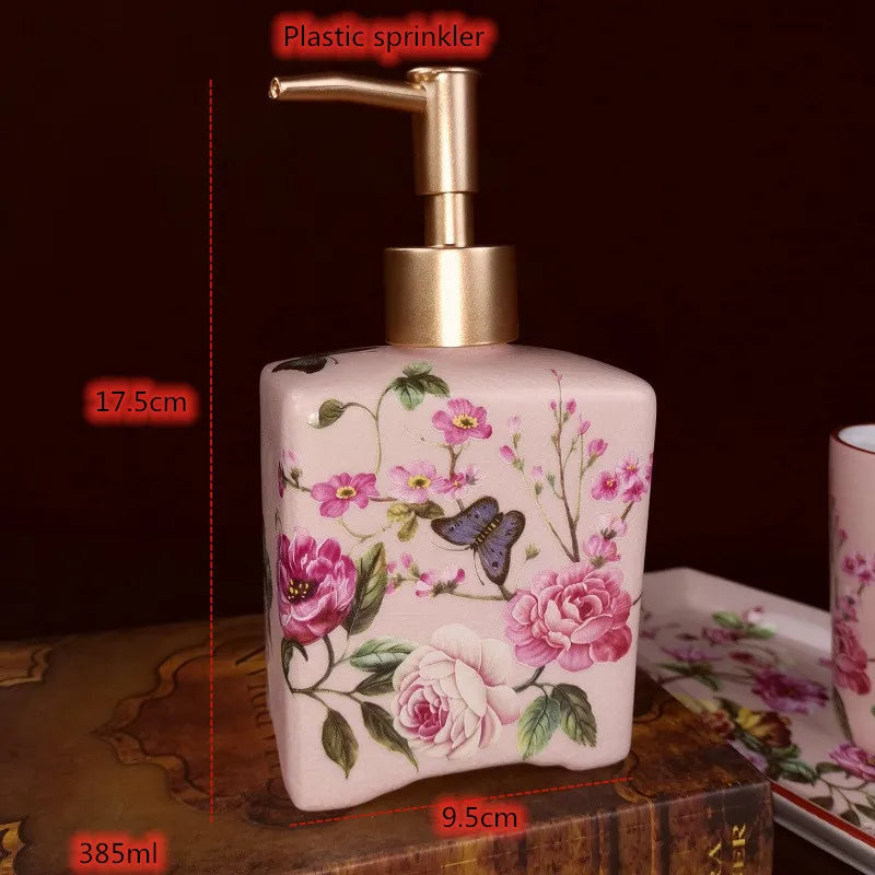Lamp Post luxury pink rose bath accessories set with ceramic toothbrush holder, soap dispenser, soap dish, and bathroom cup.