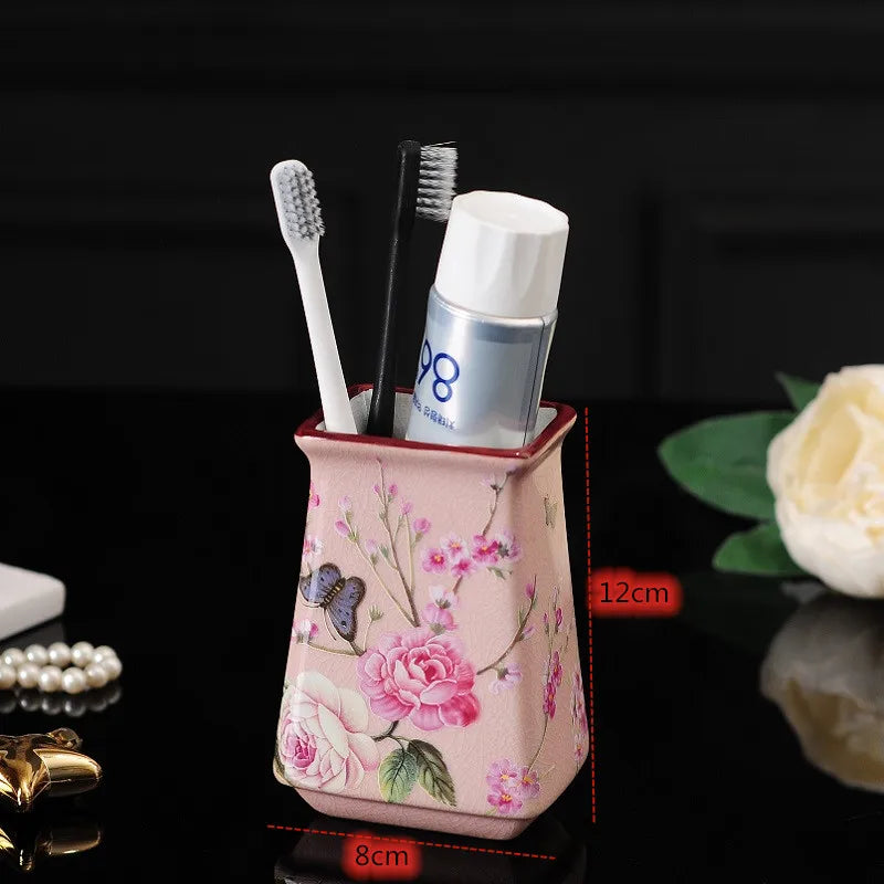 Lamp Post luxury pink rose bath accessories set with ceramic toothbrush holder, soap dispenser, soap dish, and bathroom cup.
