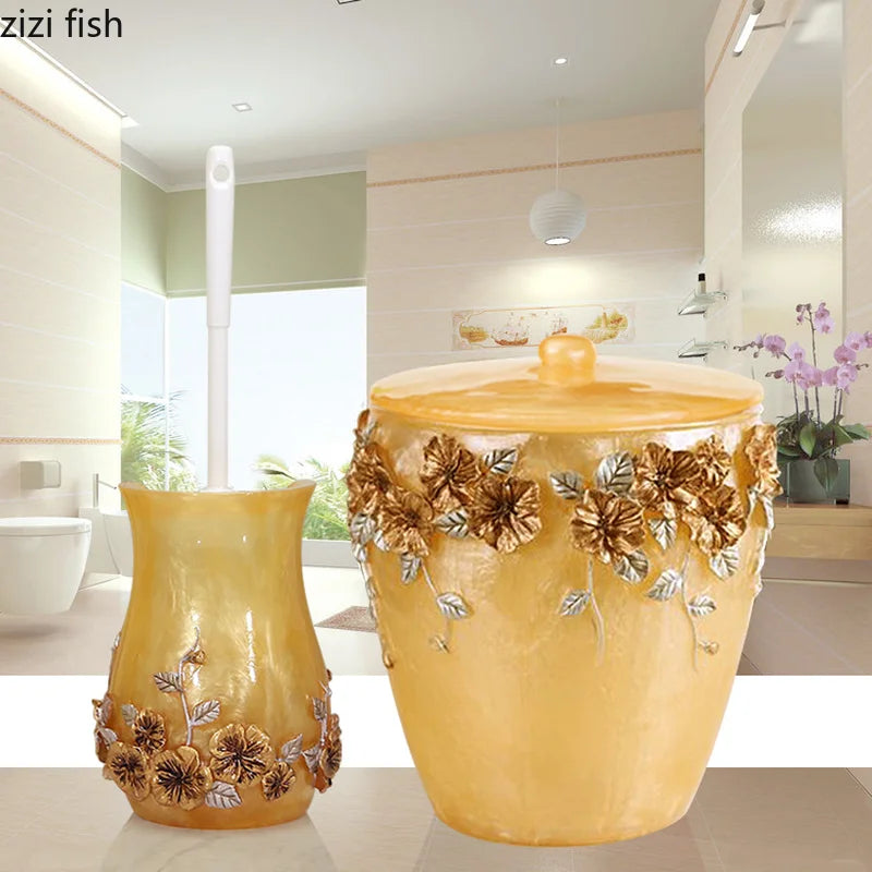 Gold Lamp Post bath accessories set including lotion bottle, toothbrush holder, soap dish, tissue box, and toilet brush.