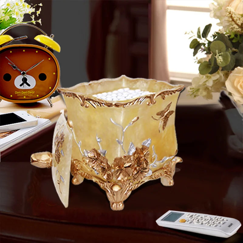 Lamp Post gold bath accessories set including lotion bottle, toothbrush holder, soap dish, tissue box, cotton swab box, toilet brush, and garbage can.