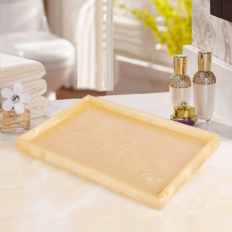 Lamp Post gold resin bath accessories set including lotion bottle, toothbrush holder, soap dish, tissue box, and toilet brush.