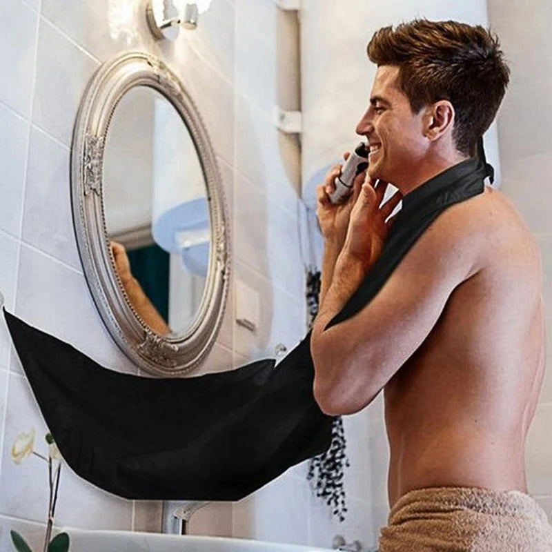Black shaving cloth for bathroom, designed for male beard trimming, by Lamp Post, used as a bathroom grooming tool.