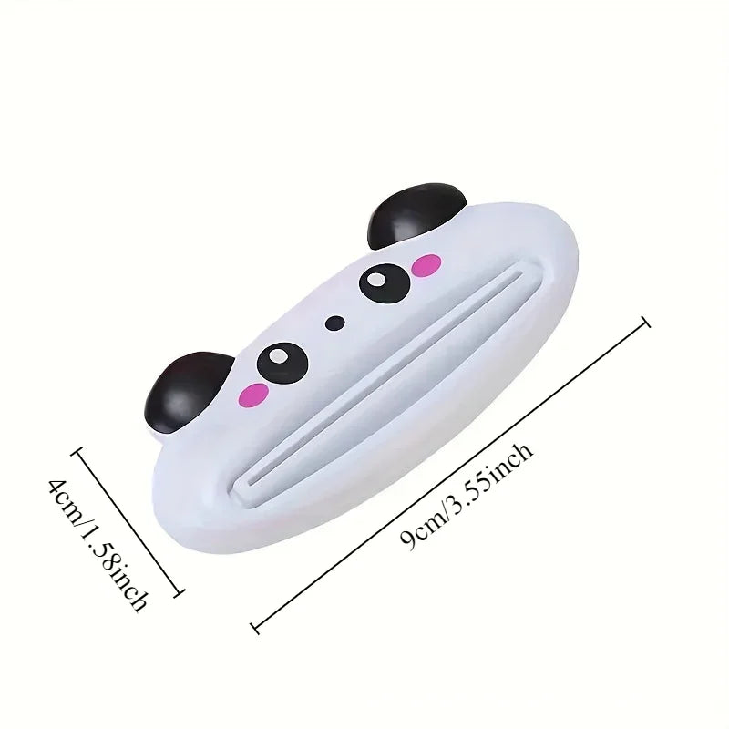 Pink cartoon rolling toothpaste squeezer dispenser from Lamp Post, a fun kid's bathroom tool to easily squeeze toothpaste from tubes.