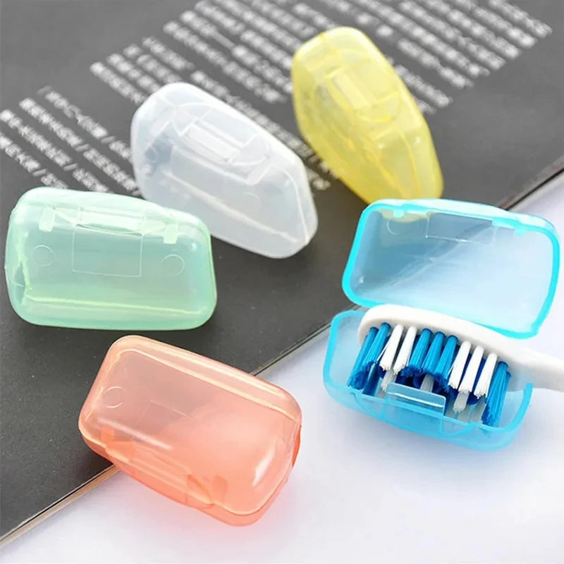 Set of five portable toothbrush head cover caps by Lamp Post, designed to protect toothbrushes, in various colors for bathroom use.