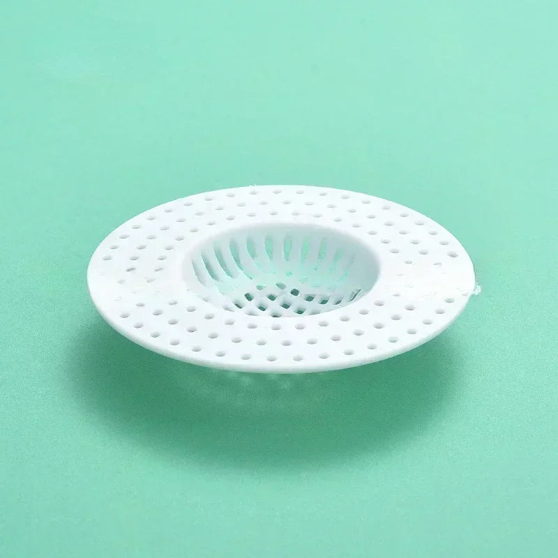 Transparent hair filter sink and bathtub drain stopper by Lamp Post for bathroom shower floor drain protection.