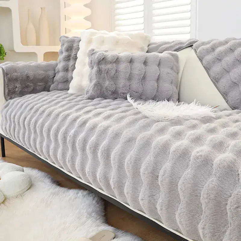 Beige non-slip sofa covers by Lamp Post, showing textured fabric and secure fit on a living room sofa.