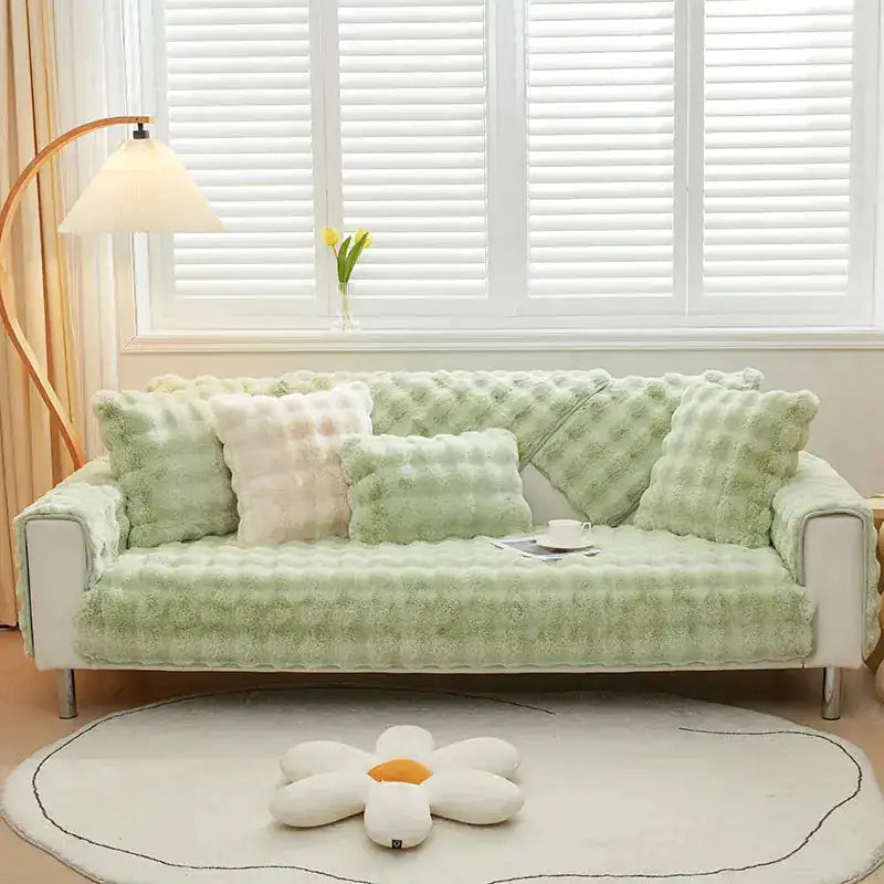 Beige Lamp Post non-slip sofa cover draped over a sofa, showing textured fabric and secure fit for protection and style.