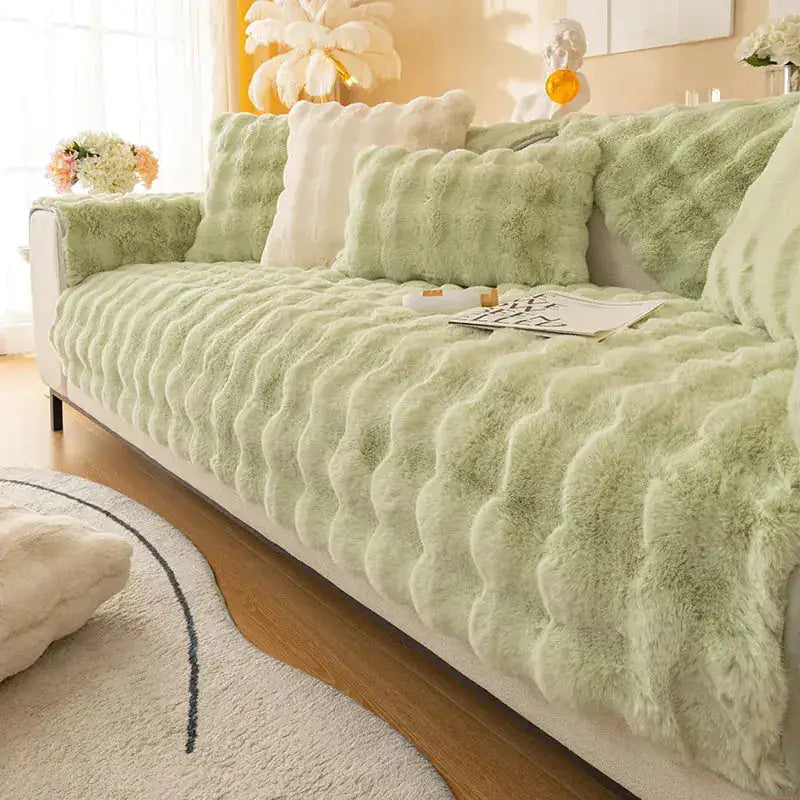 Beige non-slip sofa cover from Lamp Post, 70x70cm, designed to protect and keep fabric in place on furniture.