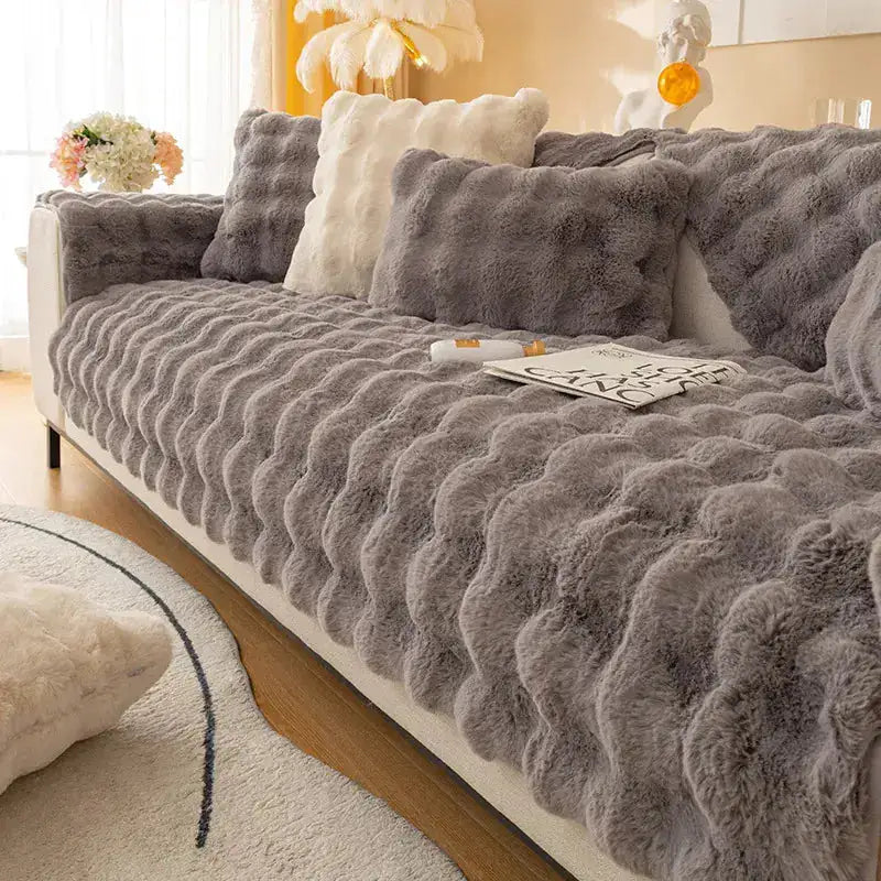 Beige Lamp Post non-slip sofa covers on a sofa, showing textured fabric and secure fit for protection and style.