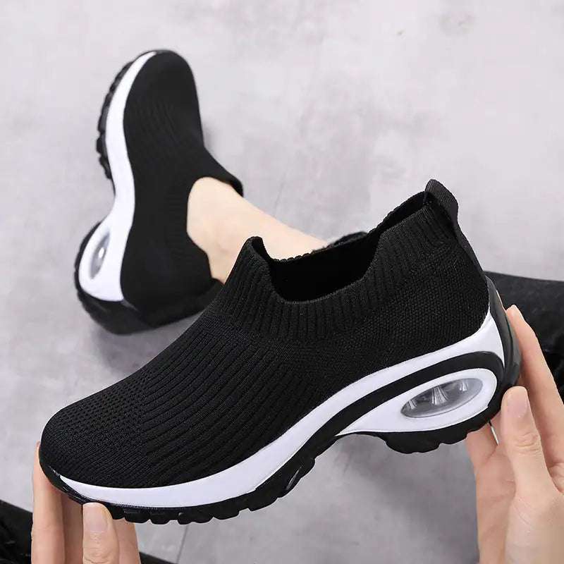 Black women's walking sneakers by Lamp Post featuring comfortable design and casual style for everyday wear.