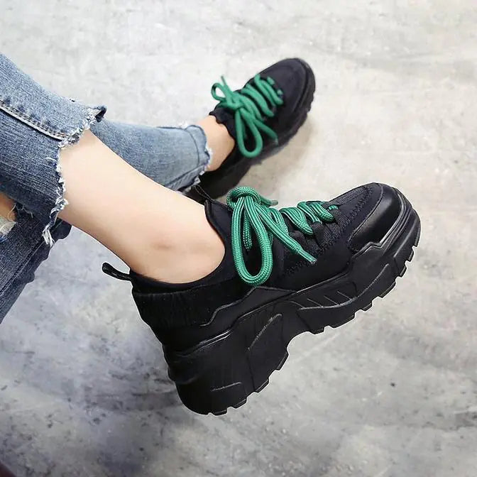 Black Bruneau women’s sneakers by Lamp Post featuring a sleek design and comfortable fit.