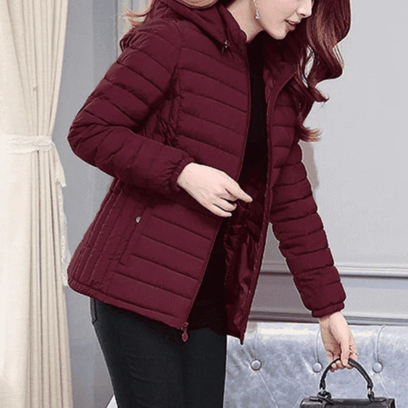 Black Lamp Post puffer coat in extra small size, showcasing its padded, insulated design and cozy winter style.