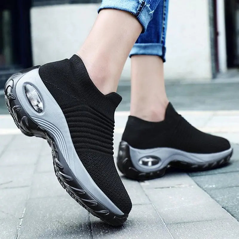 Black and gray women's sneakers by Lamp Post featuring stylish design and comfortable fit for everyday wear.