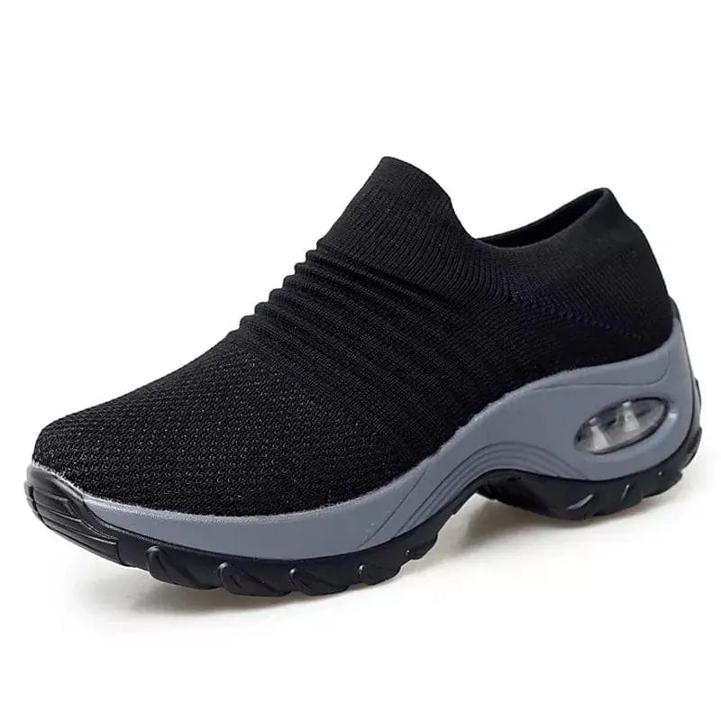Black and gray women's sneakers from Lamp Post with stylish design and comfortable fit, shown on a plain background.