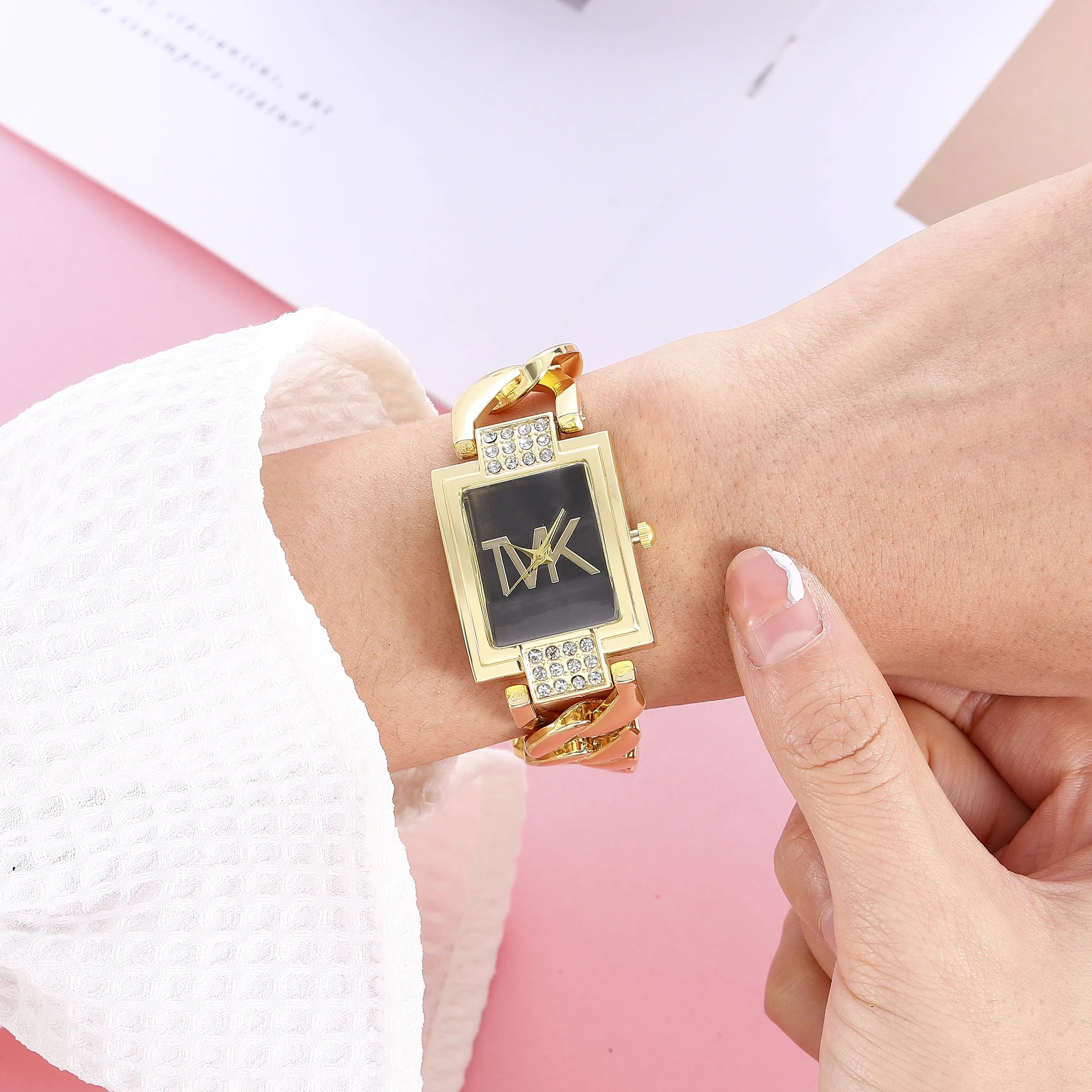 Luxury Lamp Post women's watch with a black square face, elegant metal strap, and trendy quartz movement.