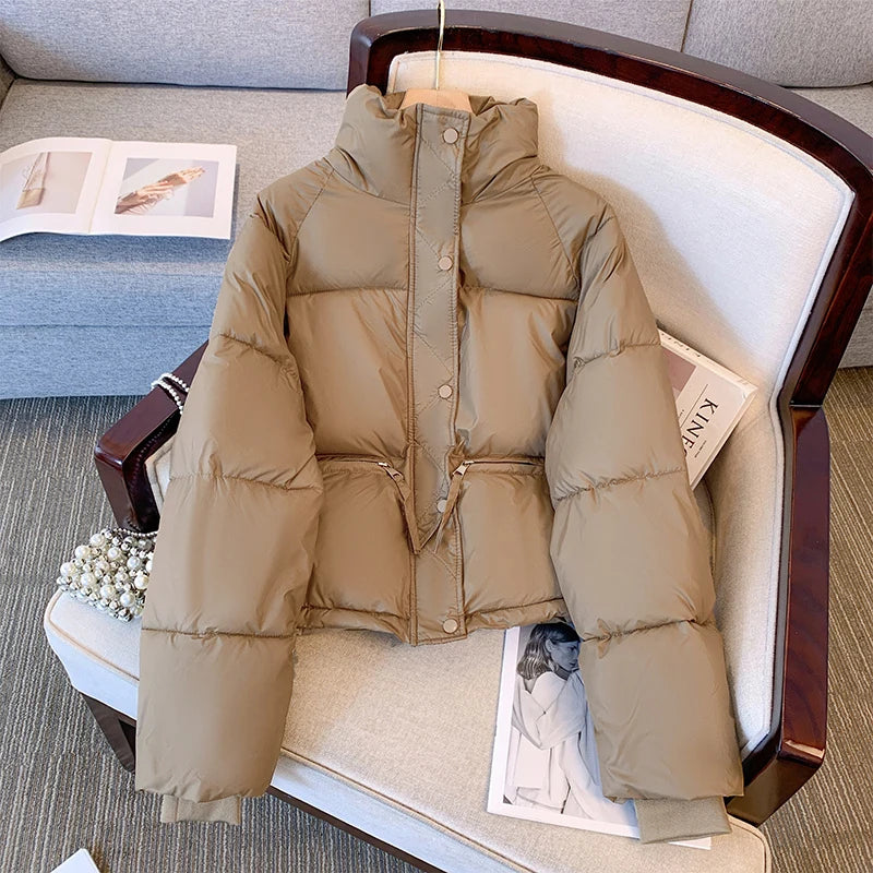 Black medium winter jacket for women by Lamp Post, featuring a cozy, insulated design with a stand-up collar and quilted exterior.