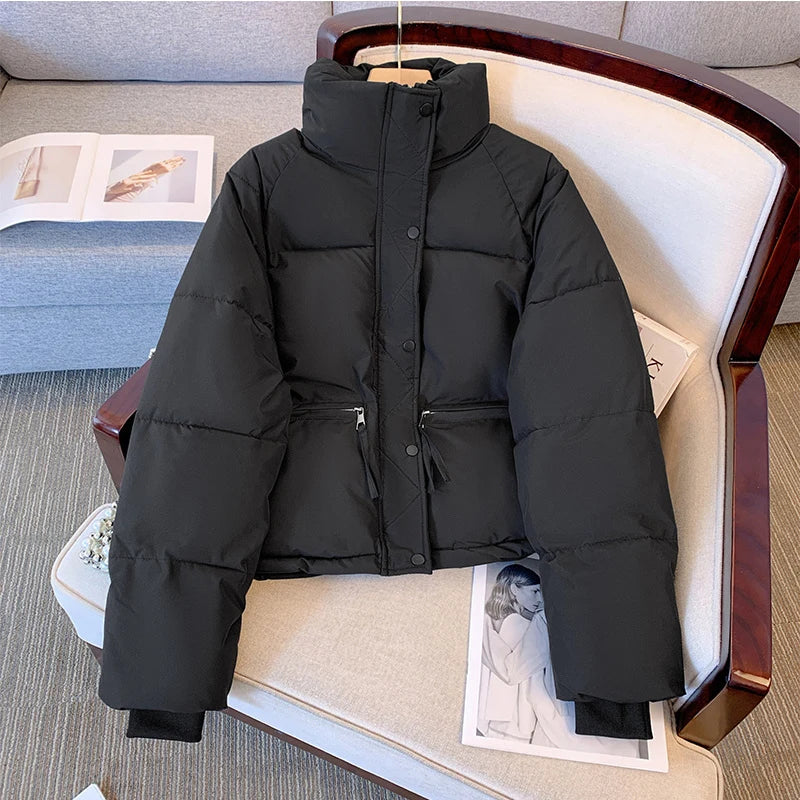 Black medium-sized winter jacket for women by Lamp Post, featuring a warm, stylish design suitable for cold weather.