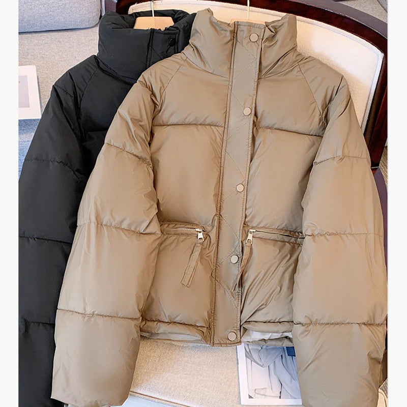 Black medium winter jacket for women by Lamp Post, featuring a stylish, insulated outerwear design with a high collar.