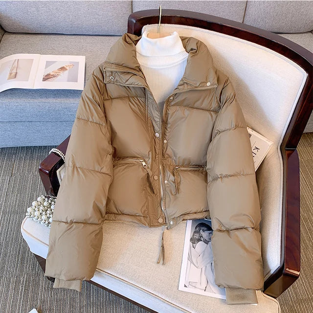 Black medium winter jacket for women by Lamp Post, featuring a stylish, insulated design for cold weather comfort.
