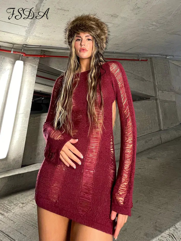 Black women’s long sleeve backless dress by Lamp Post, shown on a model, highlighting its elegant design and fit.