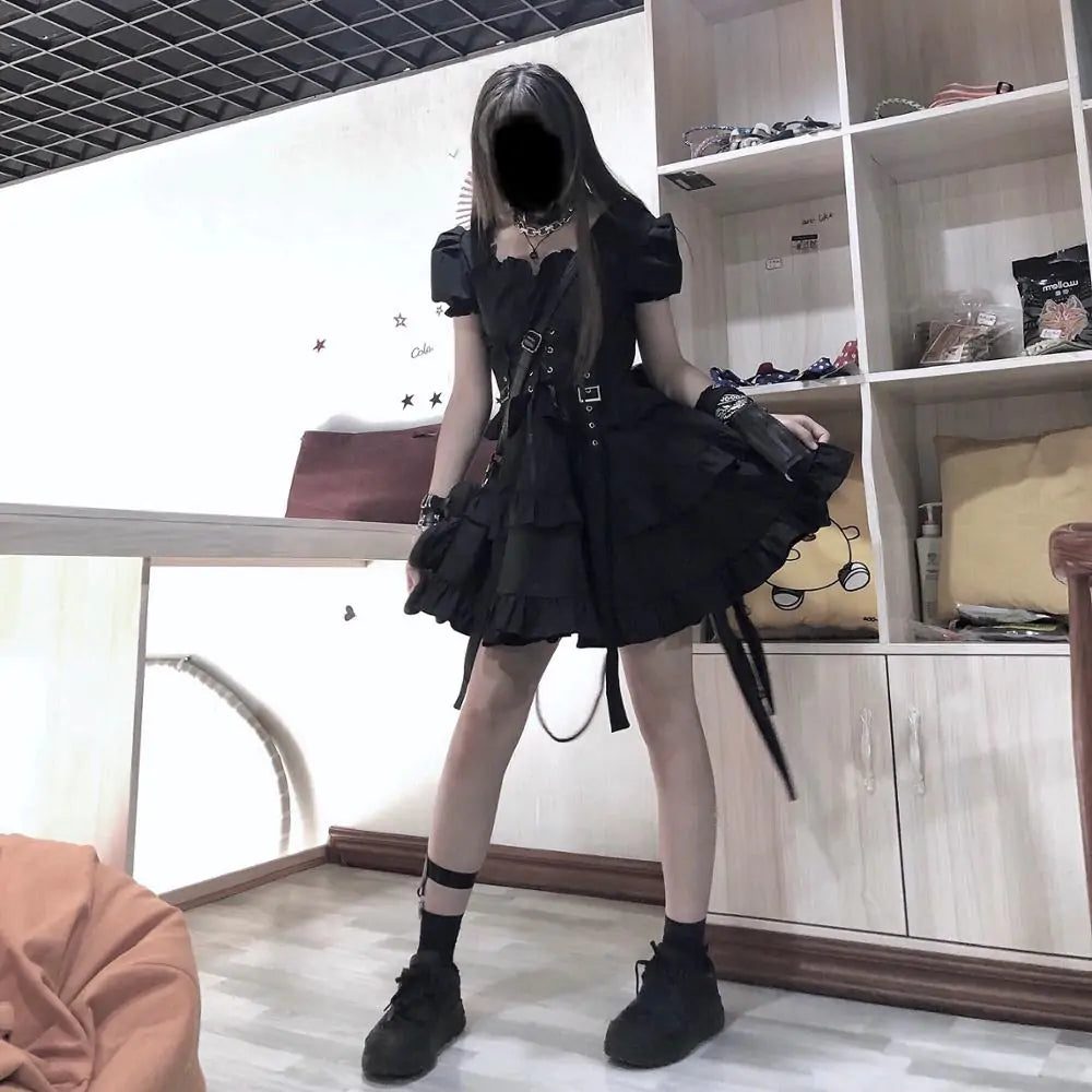 Gothic women’s black dress by Lamp Post, featuring a fitted silhouette and lace details, perfect for gothic fashion styles.
