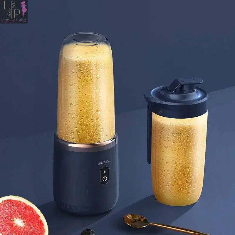 Pink portable Lamp Post blender and juicer with a compact design, perfect for making smoothies on the go.