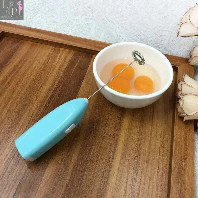 Lamp Post mini electric coffee blender handheld egg whisk mixer for drinks and milk, white compact kitchen appliance.