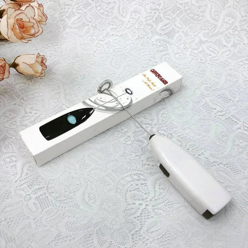White Lamp Post mini electric coffee blender handheld whisk mixer for drinks and milk, compact kitchen appliance for mixing.